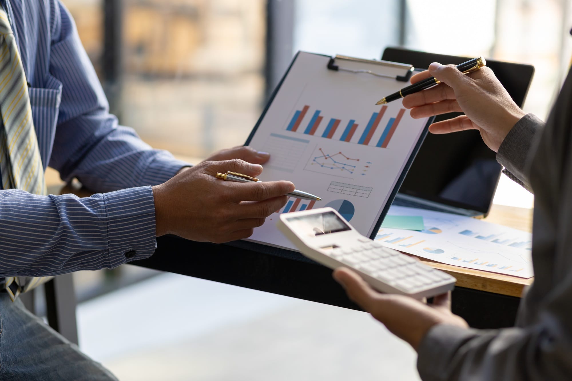 Financial advisory businessman meeting, discuss financial charts business report analyze investment.